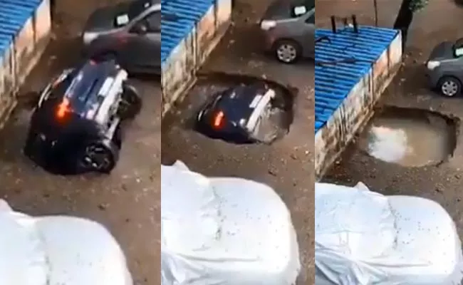 Car Swallowed Sinkhole At Mumbai Parking Lot After Heavy Rain Viral - Sakshi