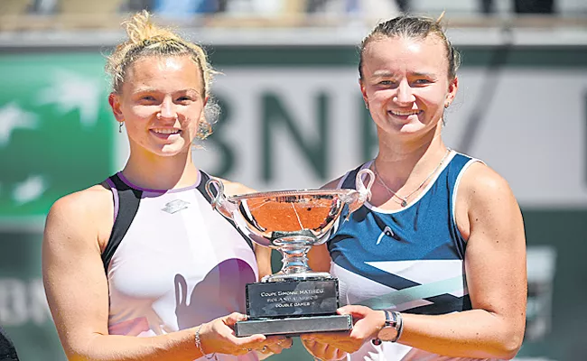 Krejcikova adds womens doubles to singles title - Sakshi