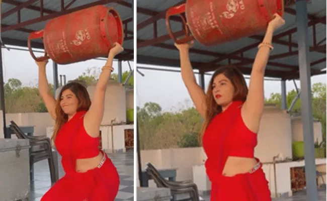 Viral Video: Woman Performs Squats By Lifting Gas Cylinder - Sakshi