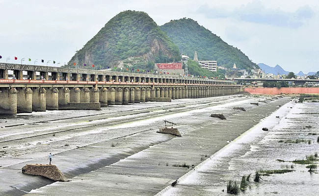 A TMC water from Prakasam Barrage into the sea - Sakshi