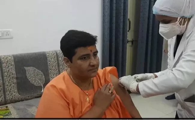 BJP Bhopal MP Pragya Thakur Gets Covid Shot At Home - Sakshi