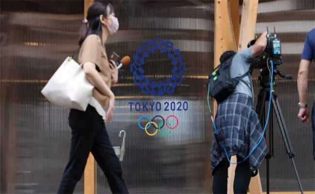 Japan PM Warns Of Closed Door Tokyo Olympics As Covid Cases Rise - Sakshi