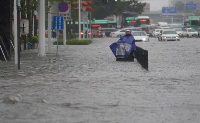 Heavy Rainfall Floods Streets And Subway Stations In China - Sakshi