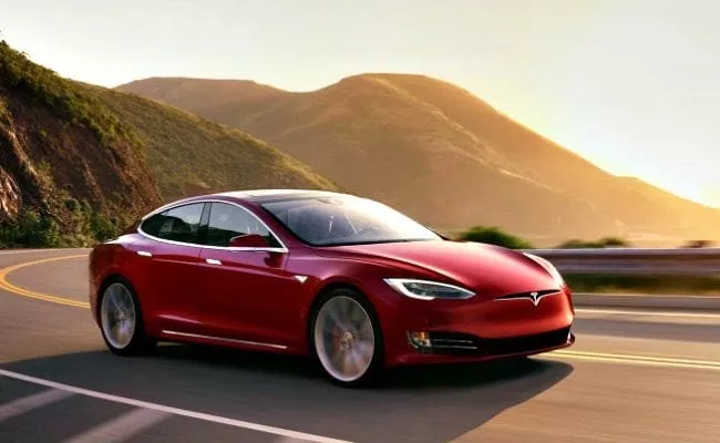 Tesla Urges Centre To Reduce Import Duties on Its Electric Cars - Sakshi