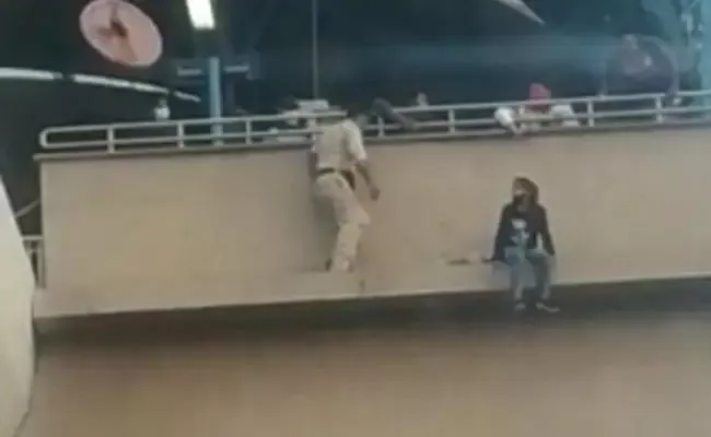 Viral: Faridabad Cops Save Lady When She Tried Jumping Off Metro Station - Sakshi