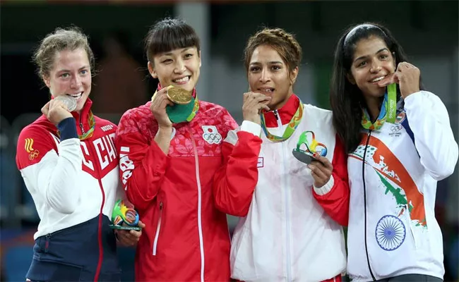 Tokyo Olympics: Why Do Athletes Bite Their Medals - Sakshi