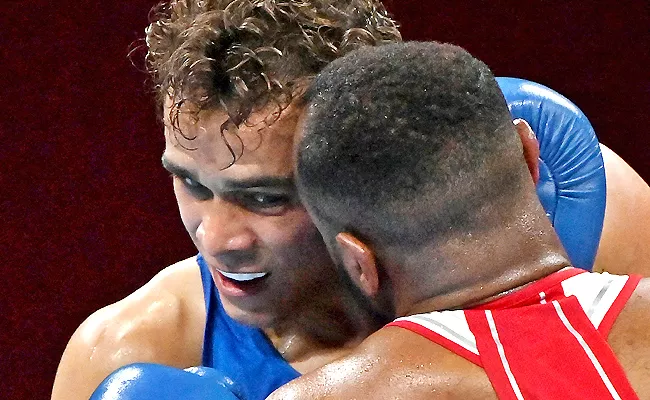 Tokyo Olympics: Boxer Attempts To Bite Opponent Ear Became Viral - Sakshi