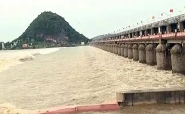 Officials Alerted To Possibility Of Heavy Flood Water Reaching Prakasam Barrage - Sakshi