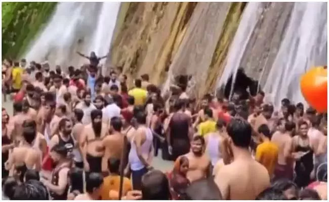 Viral Video: Hundreds Of Maskless Tourists Throng Kempty Falls in Mussoorie - Sakshi