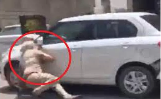 Punjab Police Dragged By Car Trying To Stop For Checking Video Viral - Sakshi