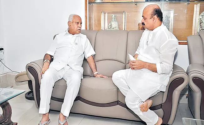 M Bommai Meets Yediyurappa Amid Discontent Over Portfolio Allocation - Sakshi