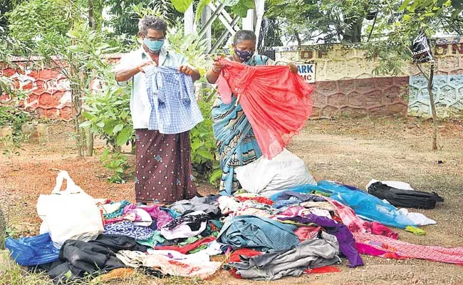 Old Dresses For Needy And Poor People In A Park Visakhapatnam - Sakshi