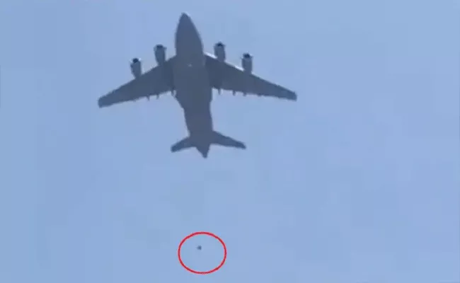 Shocking Video: 2 People Falling Off Plane Mid Air In Kabul - Sakshi