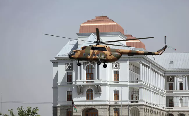 Afghan President Ghani flees Kabul in helicopter stuffed with cash - Sakshi