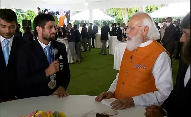 You Did Not Smile Even On Olympic Podium, PM Complains To Silver Medallist Ravi Dahiya - Sakshi