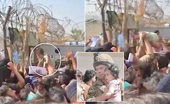 Desperate Afghan mums throw babies over barbed wire - Sakshi