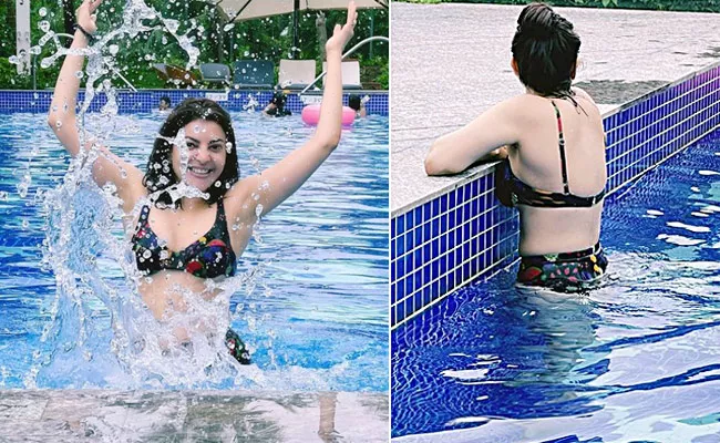 Kajal Agarwal relaxing in the pool in Black bikini Photes shared - Sakshi