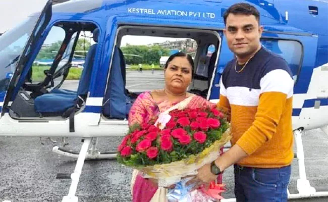 Son Booked Helicopter Ride To Mother Birth Day In UlhasNagar - Sakshi