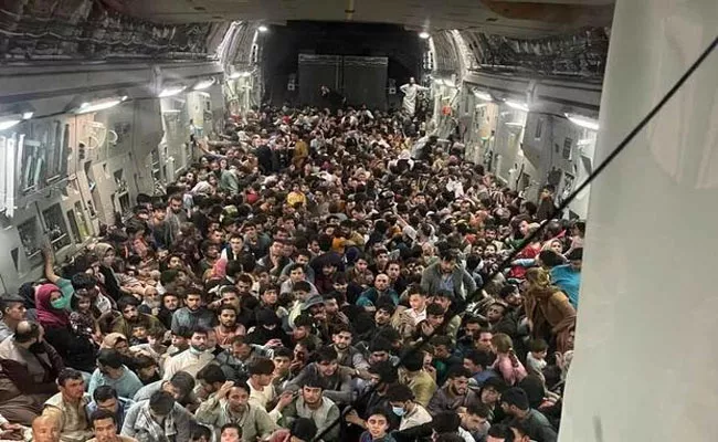 823 Afghan refugees crammed into US plane  - Sakshi