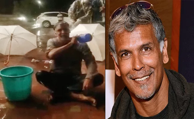 Actor Milind Soman Taking Bath on Road, Video Goes Viral - Sakshi