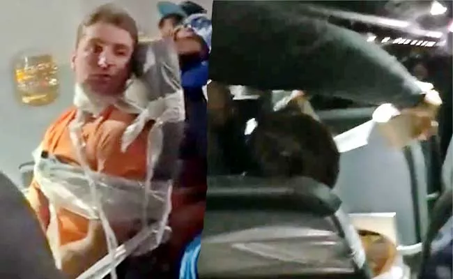 Viral Video: US Man Assaulting Flight Cruew And Taped To Seat - Sakshi