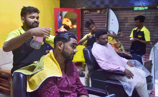 Adilabad: Fire Hair Cutting Trending In Villages - Sakshi