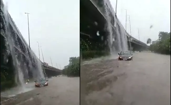 Is that Niagara falls? Twitter users ask after video of water flowing over Delhi over-bridge surfaces - Sakshi