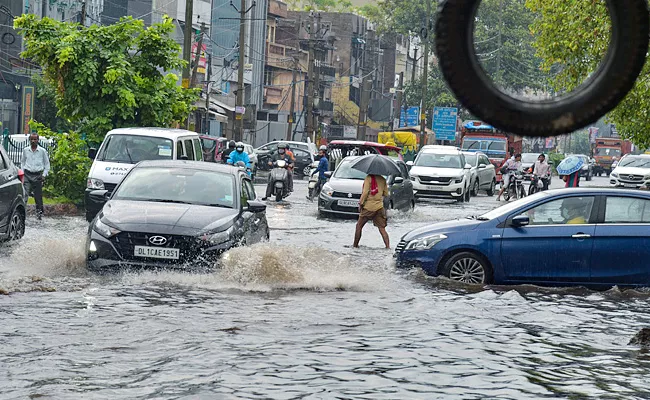 Heavy Rainfall In New Delhi - Sakshi