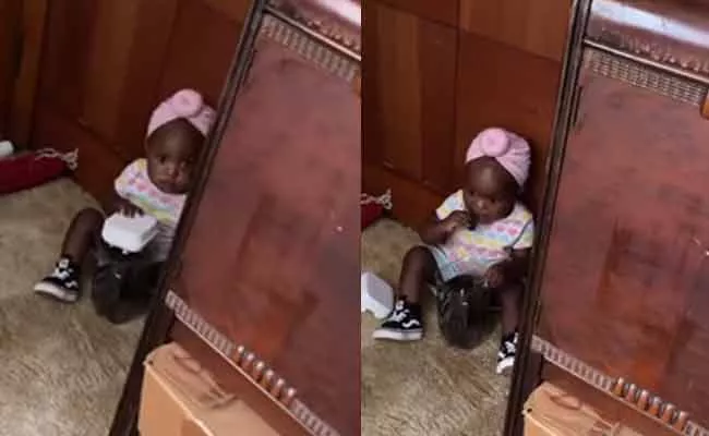 Viral Video: Dad Catches Her Cute Child While Eating Cookies - Sakshi