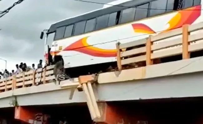 Bus Hangs From Railing In Kurnool - Sakshi