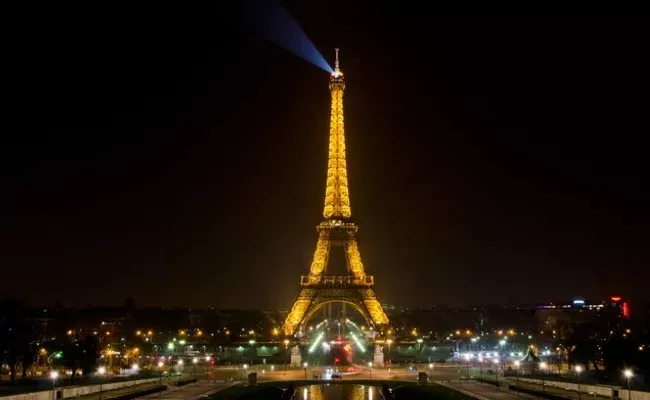 Why it is illegal to take photos of the Eiffel Tower at night - Sakshi