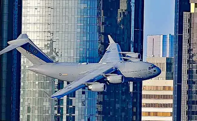 RAAF C-17 Cargo Iet Weaves Through Skyscrapers In Australia