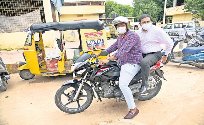 Hyd Collector L Sharman Visits Slum At Rasoolpura On Bike - Sakshi