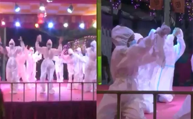 Gujarati Girls Performing Dance in PPE Kits During Navratri in Covid Situation - Sakshi