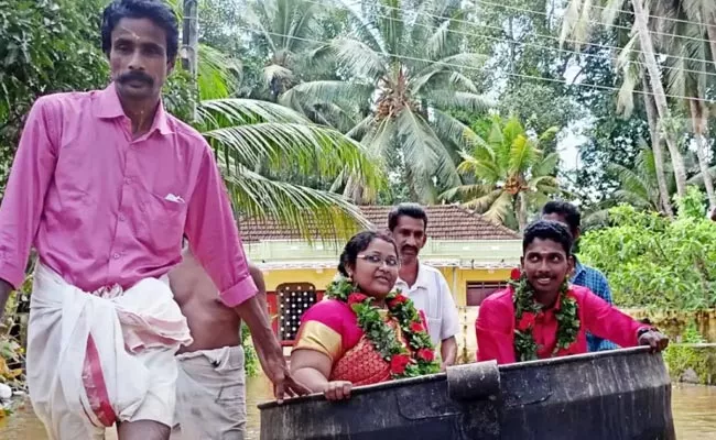 Viral: Kerala Couple Float Cooking Vessel Reach Flooded Wedding Hall - Sakshi