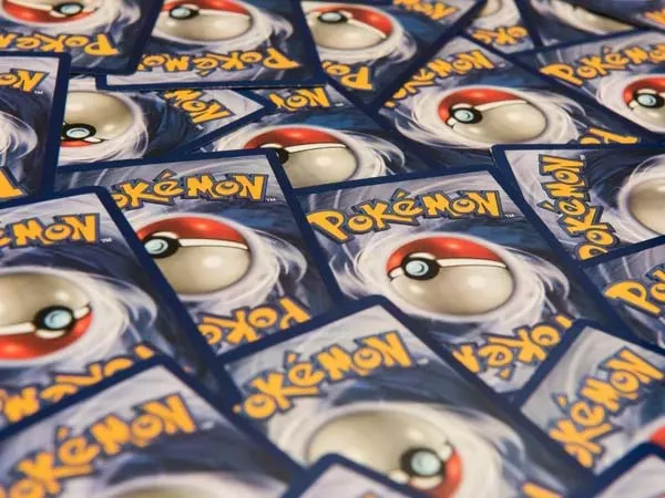 A Us Man Uses Covid Relief Loan To Use The Money To Buy A Rare Pokemon Card - Sakshi