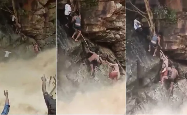 Tamil Nadu Forest officials Rescuing woman, Baby From Beside Waterfalls - Sakshi