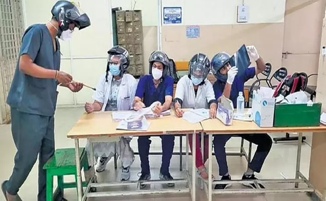 Osmania General Hospital doctors Protest With Helmets - Sakshi