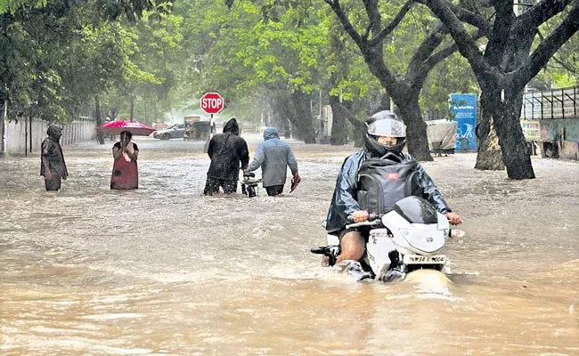 Roads In Chennai Were Submerged Due To Heavy Rain - Sakshi