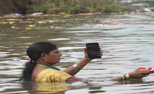 Woman Offering Karthika Special Deepam In Karimnagar - Sakshi