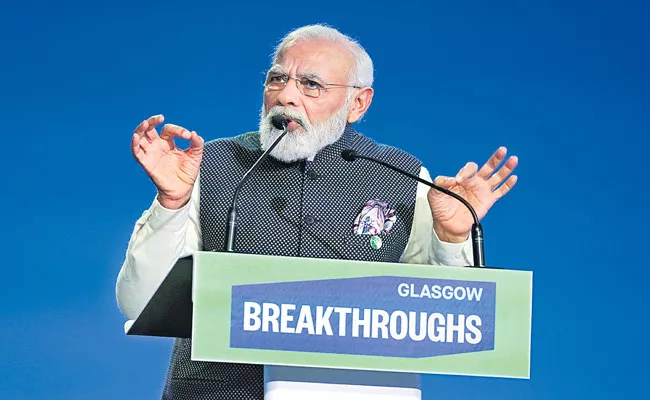 PM Modi ambitious dream of Green Grids Initiative-One Sun One World One Grid launched at COP26 - Sakshi