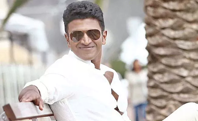 Puneeth Rajkumar And His Father Rajkumar Painting Goes Viral - Sakshi