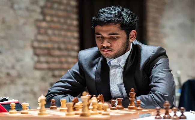 Telangana Gm Erigaisi Arjun placed third at the Lindores Abbey Blitz Chess Tournament in Latvia - Sakshi