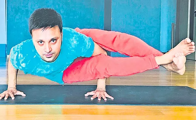 Anakapalle Man Got Place In Yoga World Records At China - Sakshi