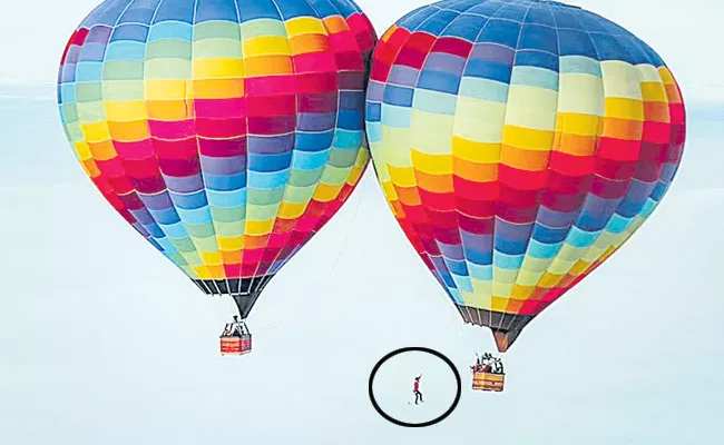 Brazilian Man Sets New Record For Tightrope Walking Between Two Hot Air Balloons - Sakshi