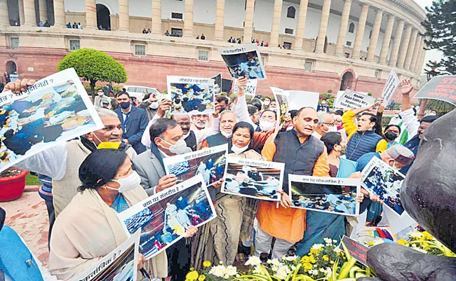 Govt, Opposition spar over suspension of MPs at Gandhi statue - Sakshi