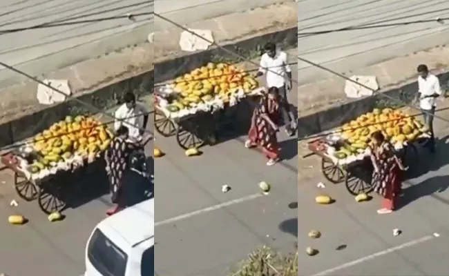 Angry Woman Throws Fruits Roadside Vendor Cart On Road Mp Goes Viral - Sakshi