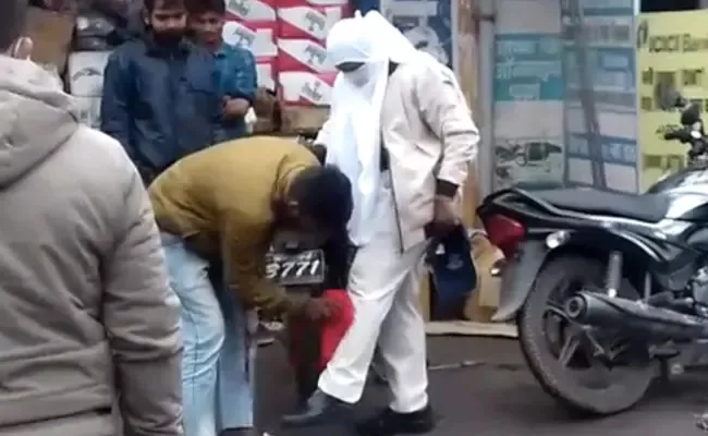 Viral Video: Police Women Forced Man To Clean Her Trousers  - Sakshi