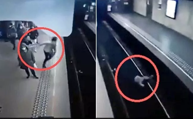 Shocking Video: Man Deliberately Pushed Woman In Front Of Train - Sakshi