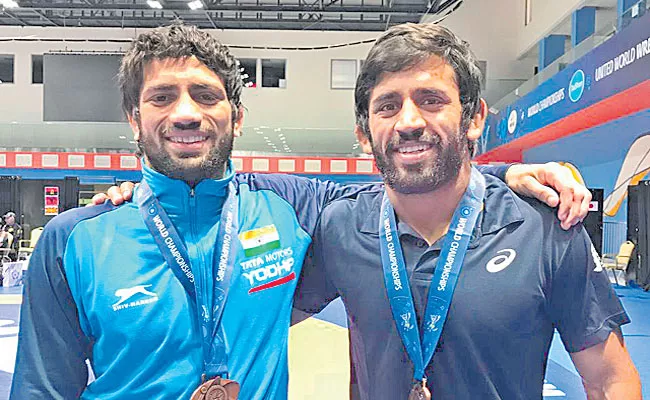 Wrestler Ravi Dahiya Bajrang Punia Choose To Train With Indian Coaches - Sakshi